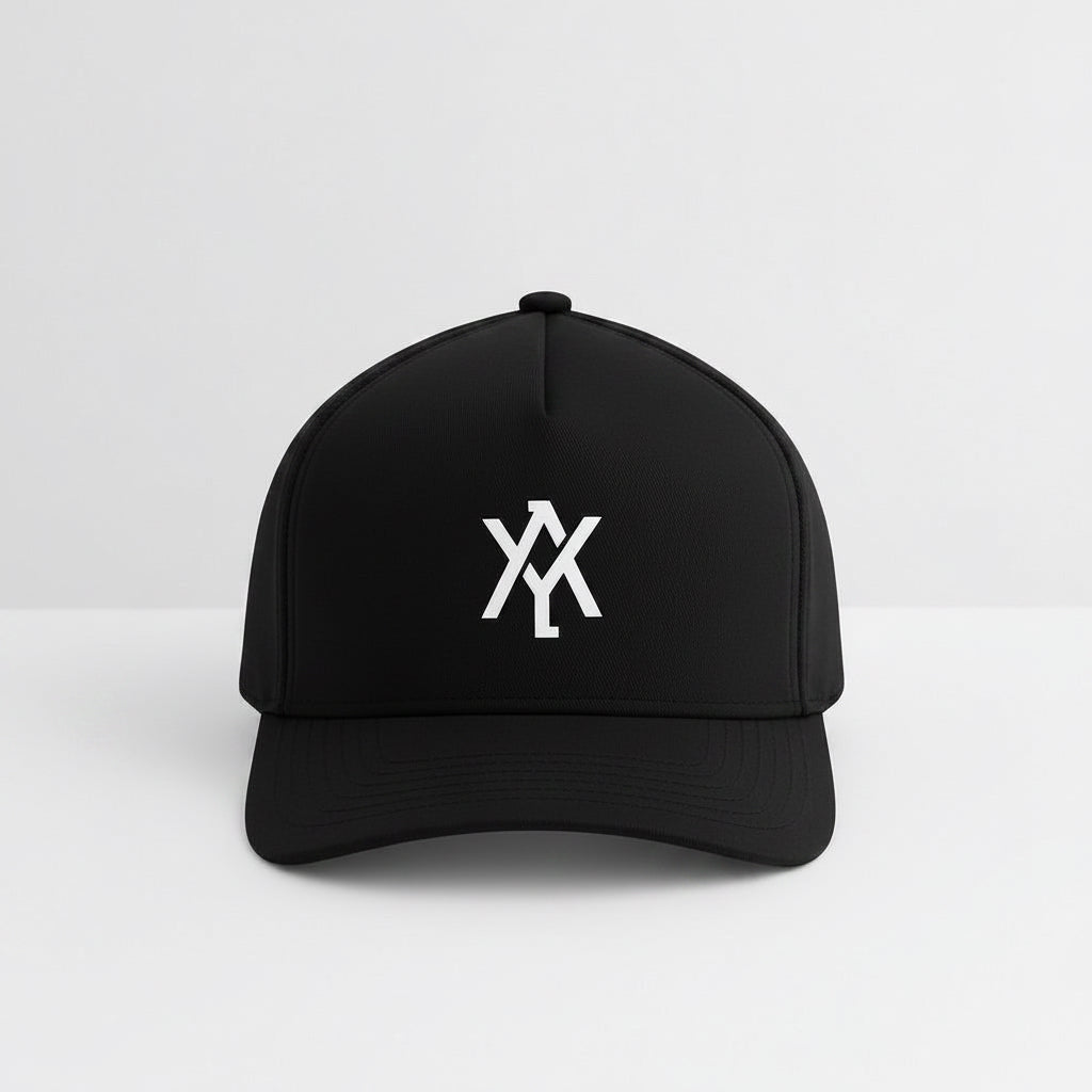 A black trucker-style cap with a white embroidered monogram logo on the front, set against a clean white studio background.