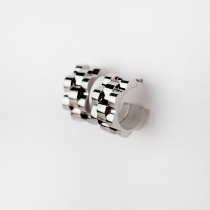 Titan Crest curved earrings